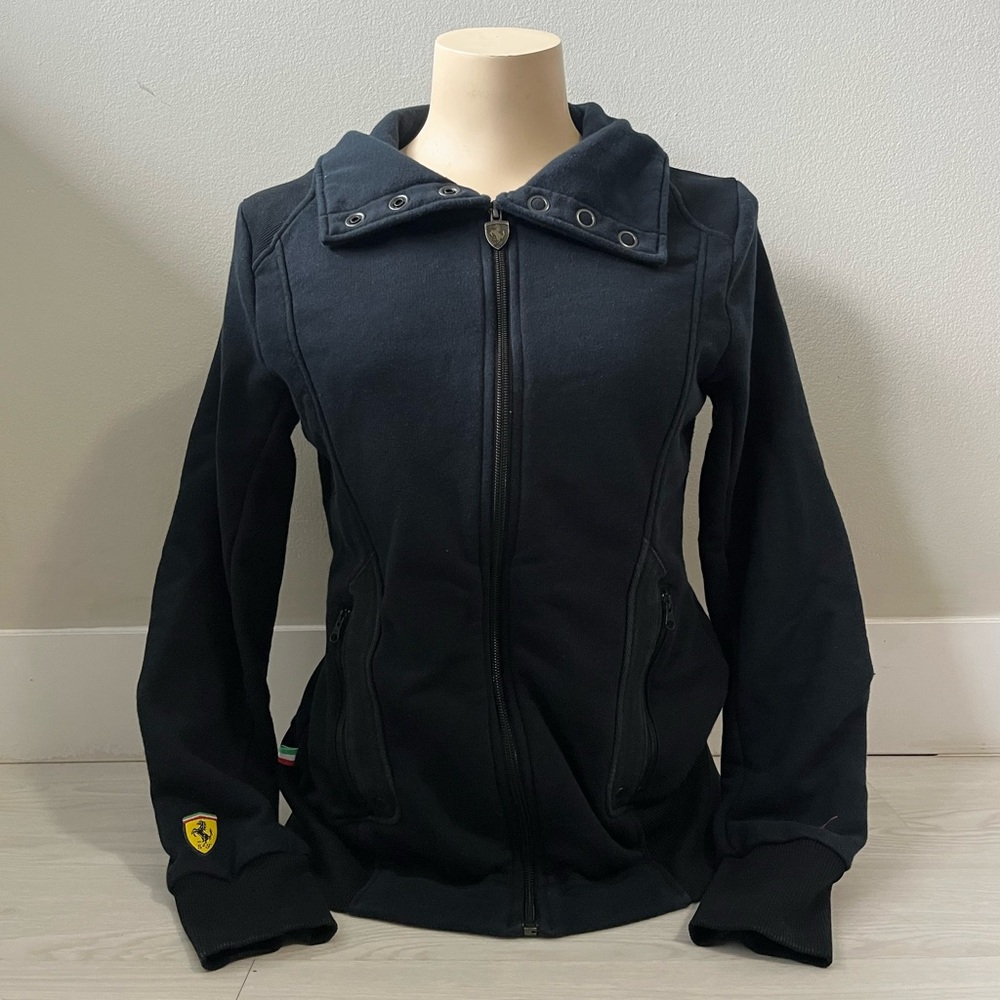 black PUMA Scuderia Ferrari Formula 1 race track jacket featuring a high collar